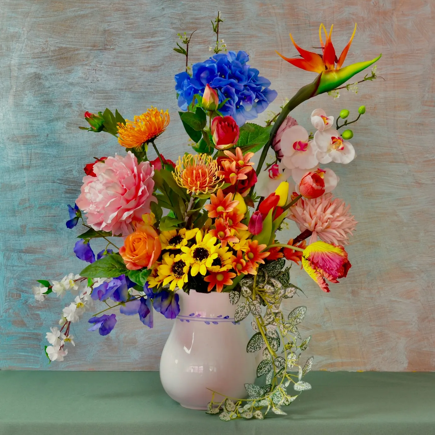 Color-rich floral arrangement in a white vase.